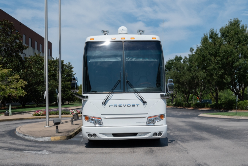 Front view of a Prevost H345 entertainer bus for sale, featuring its premium design and road-ready build, ideal for tours and high-end travel.
