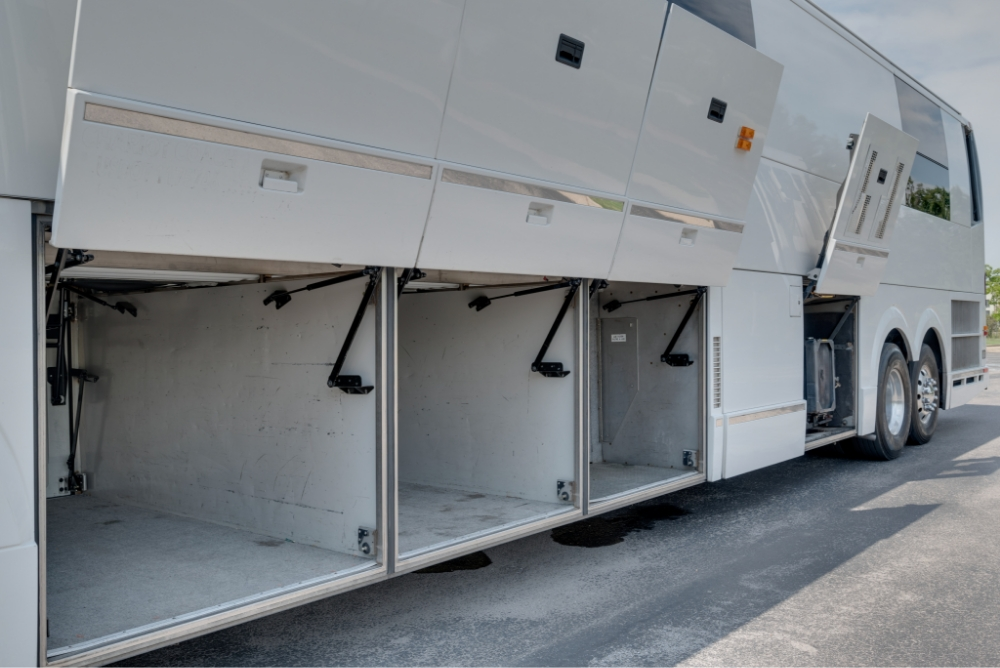 View of additional open storage compartments in a Prevost H345 bus, offering ample space for gear and supplies, ideal for long-distance journeys.