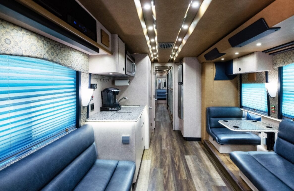 Interior shot of the 2007 Prevost XLII bus lounge area, featuring a comfortable seating arrangement with modern design