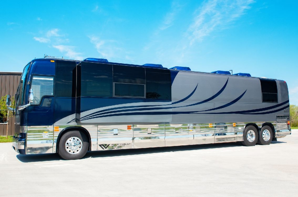 Side view of a 2006 Prevost XLII bus conversion for sale, featuring a sleek design perfect for luxury and entertainer bus needs.