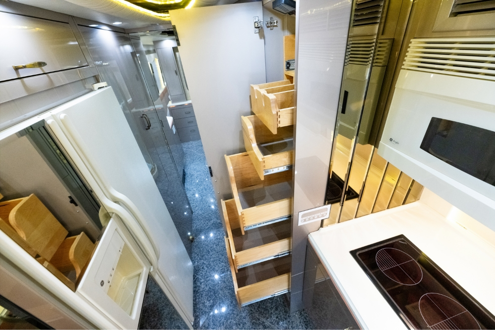 Storage inside a used Prevost bus for sale, leading to the bedroom area.