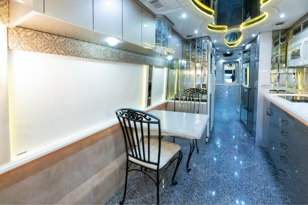 Modern and luxurious interior design inside a used Prevost bus for sale motorhome.