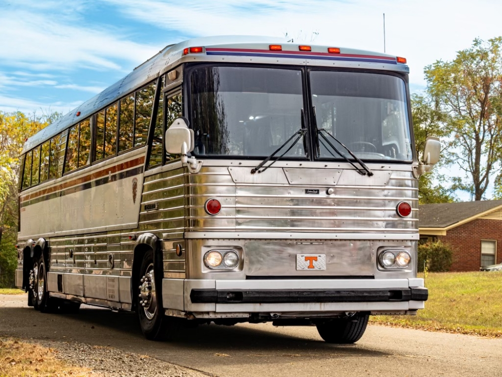 Front view of a 1976 MCI 8 bus conversion for sale, showcasing its vintage style and sturdy build, perfect for executive travel or luxury conversions.