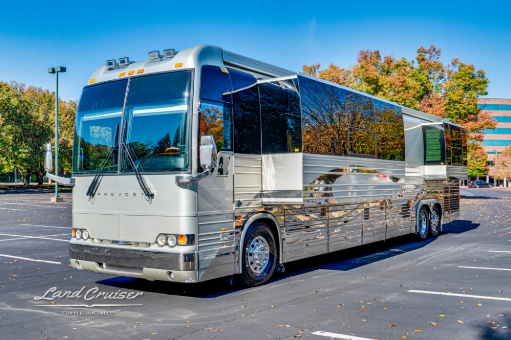 Side of Prevost XLII bus with sleek silver detailing, perfect for road trips.