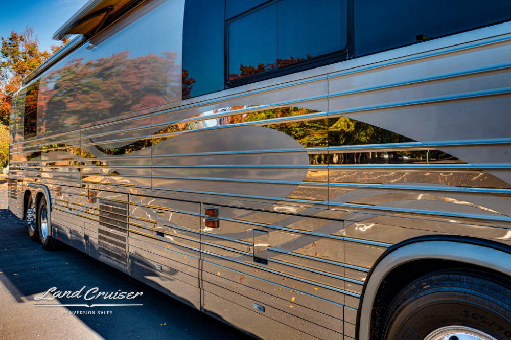 Close up side view of a 6 bunk entertainer bus for sale.