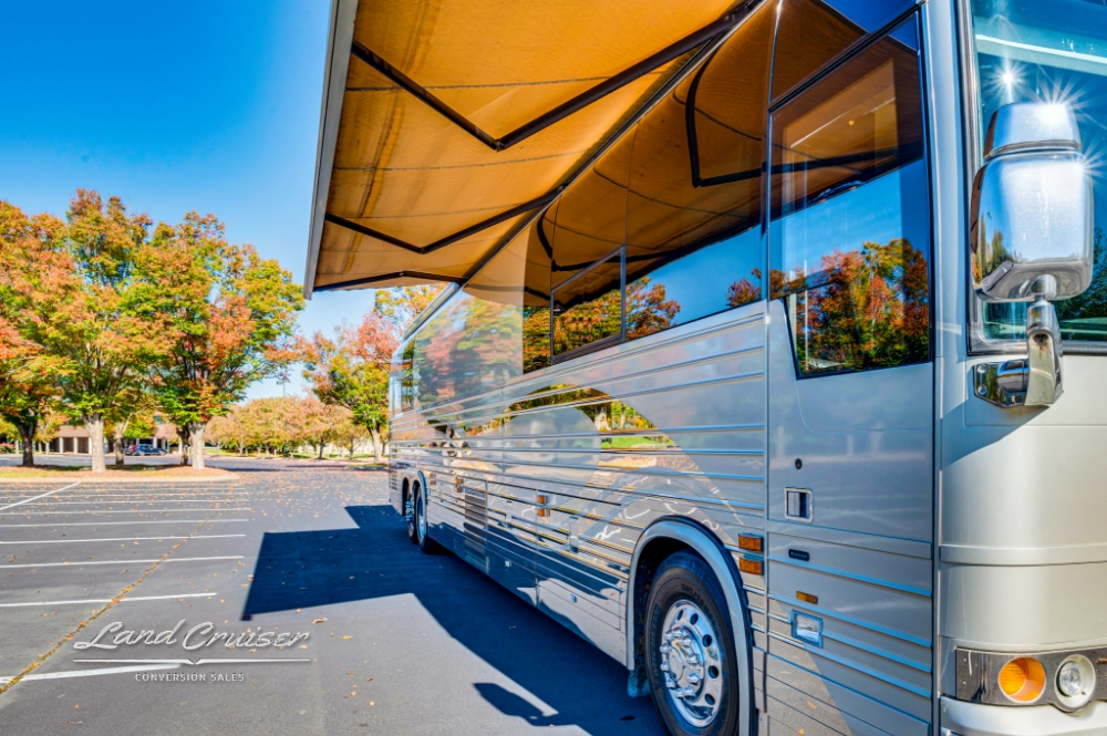 Side view of a 6 bunk 2006 Prevost bus with silver reflective finish.