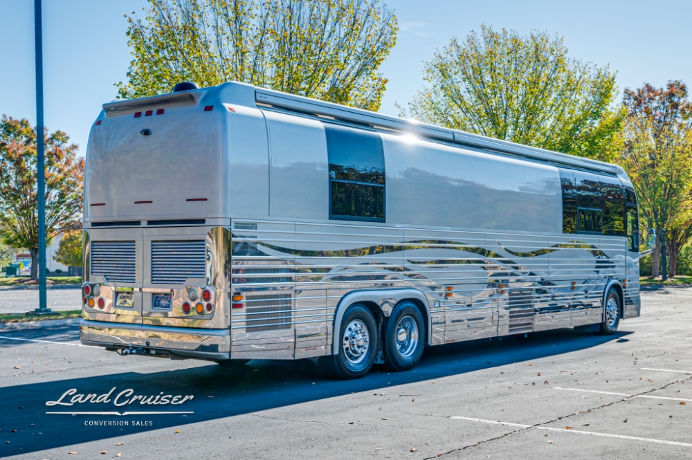 Rear-side view of a luxurious Prevost bus, perfect for entertainer tours.