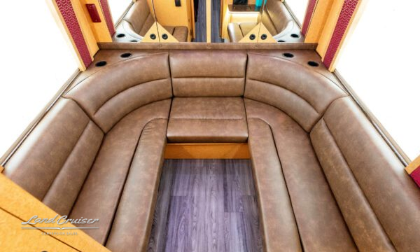 Rear lounge seating in an entertainer bus.