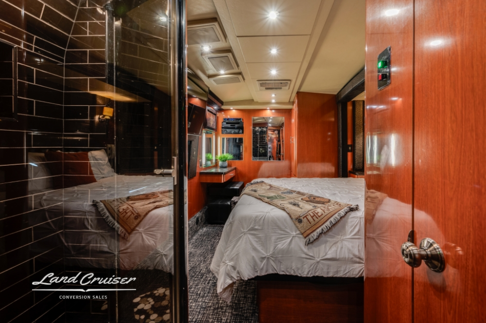 Queen bedroom in luxury Prevost entertainer bus, 2006 XLII model.