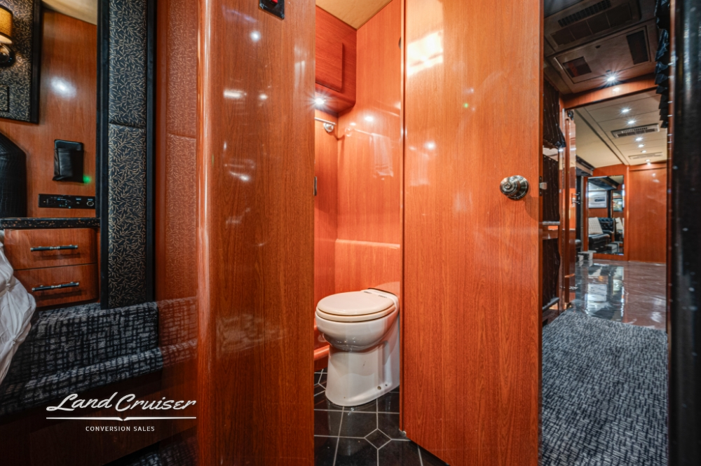 Modern bathroom with granite counters in 2006 Prevost XLII tour bus.