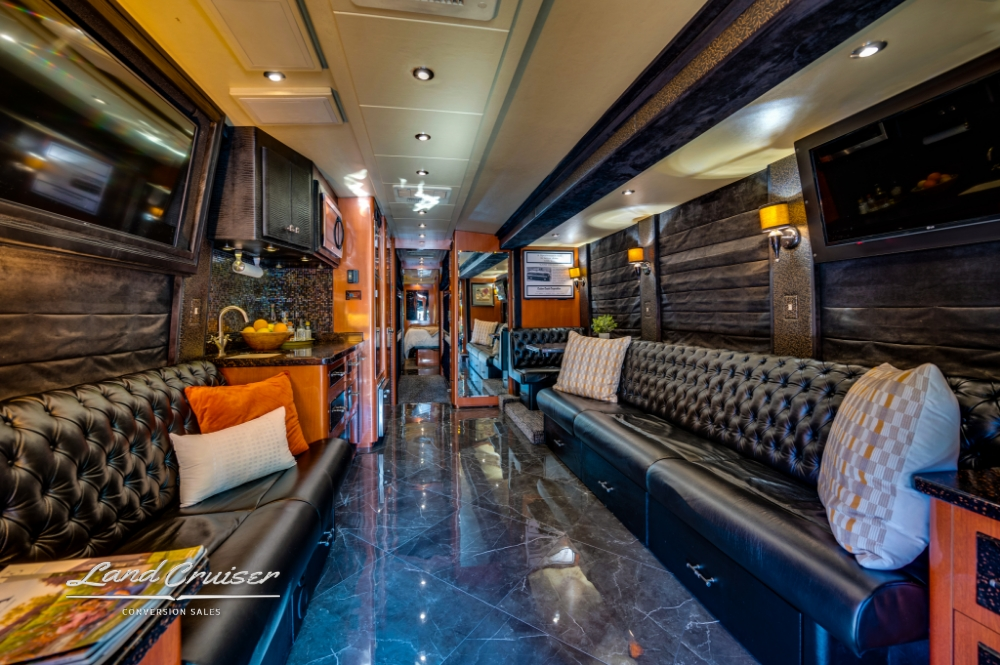 Leather lounge seating area in 6 bunk entertainer bus, 2006 Prevost XLII.