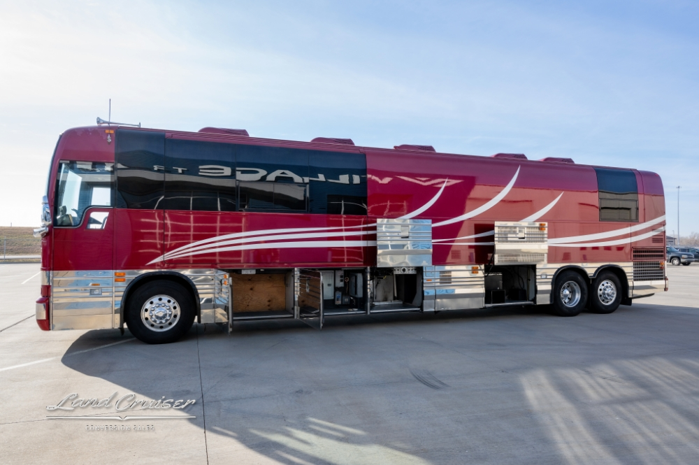 Side view of a Entertainer Coach showcasing storage compartments & air horns