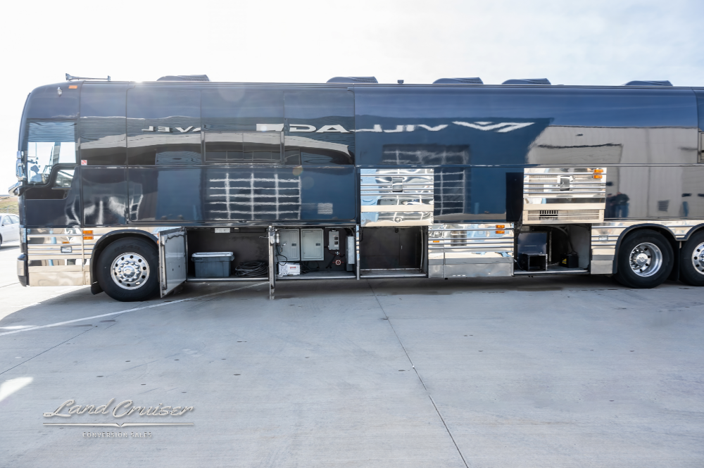 View of open storage compartments on a Entertainer Coach for sale
