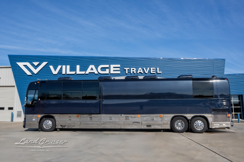 View of Entertainer Coach showing air horns, fog lights, and the view of a slide out.