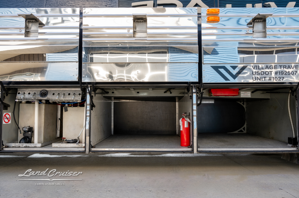 View of open storage compartments that highlight all the storage this bus offers