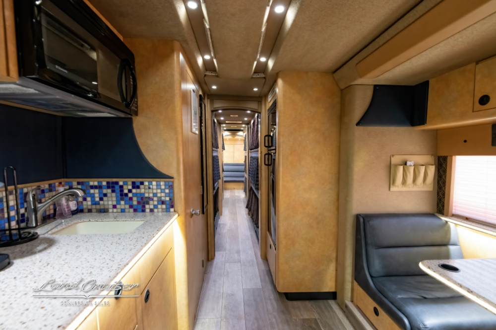 Dining room view showcasing cup holders built into a prevost coach dining room table