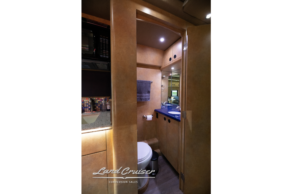 view of bathroom entry on a 12 bunk entertainer coach