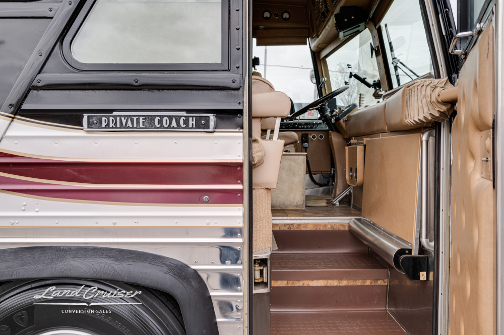 View of the stairs going into a 1978 MCI Bus Conversion