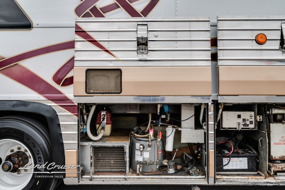 Compartment view showing water heater & system on a conversion bus