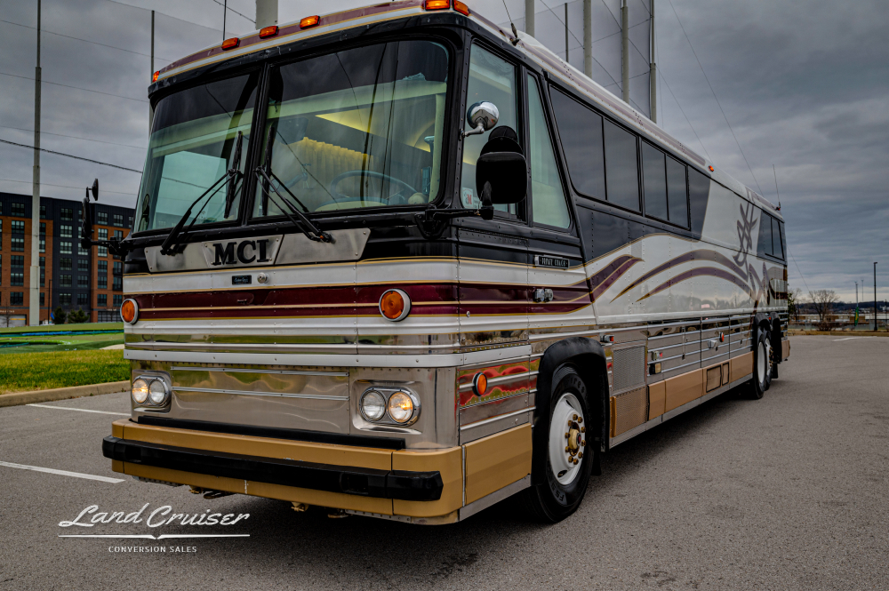 View of a MCI bus parked in a parking lot