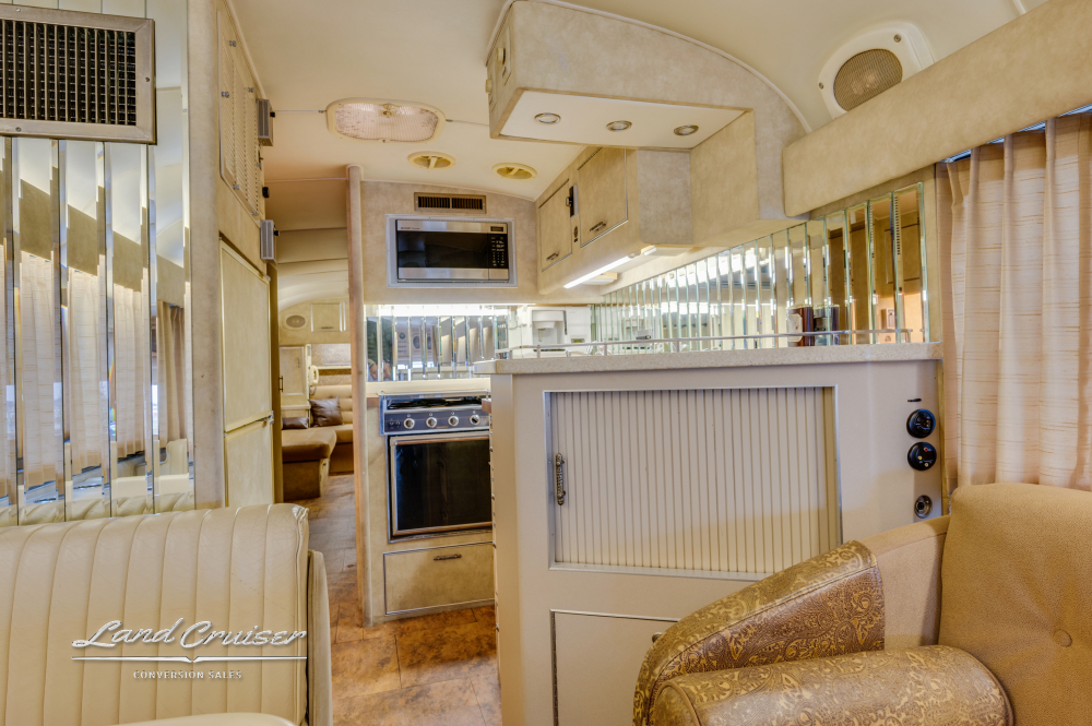 View of the spacious kitchen inside a MCI 8 bus conversion