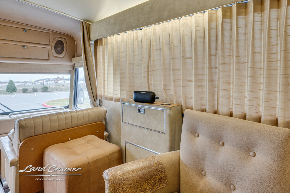 Seating area inside a MCI 8 showcasing it's comfortable furniture