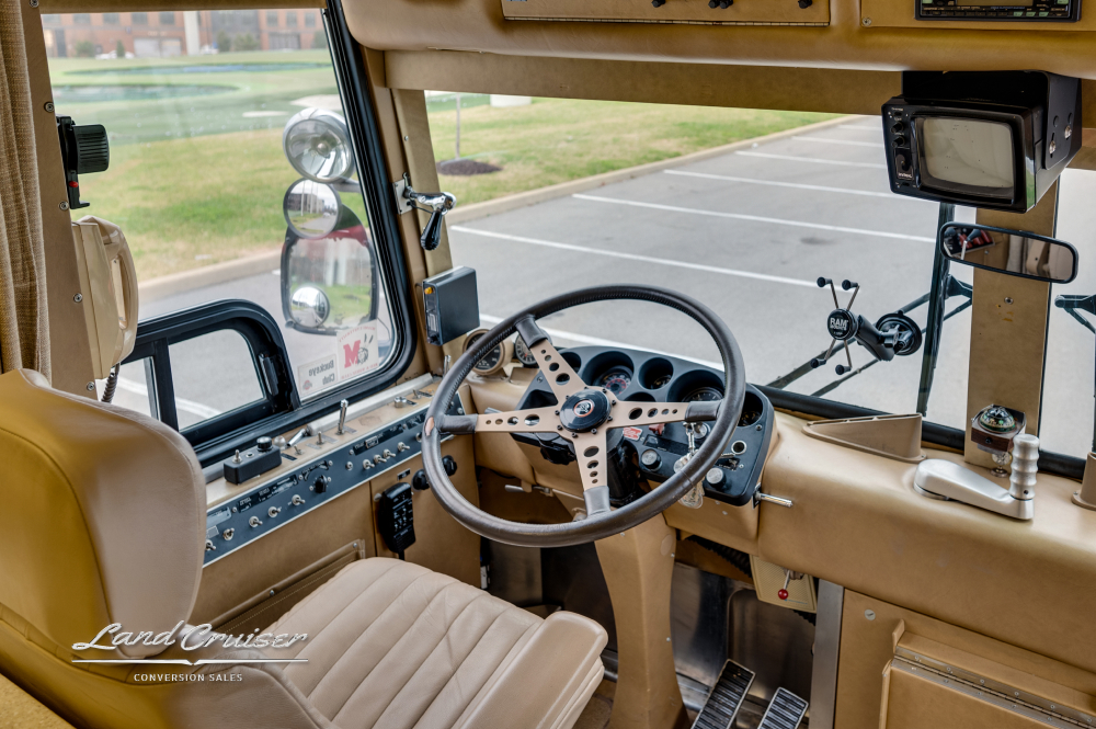 Another view of the drivers cockpit inside a bus with a Detroit 8V71 engine