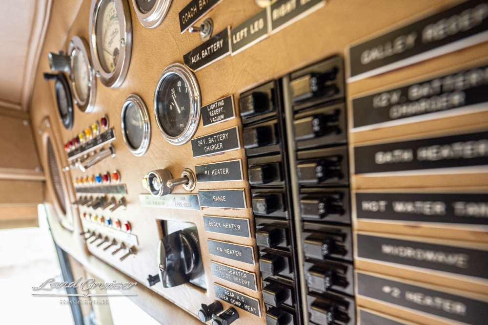 Close up view of driver controls inside a bus that was converted by Custom Coach Corporation