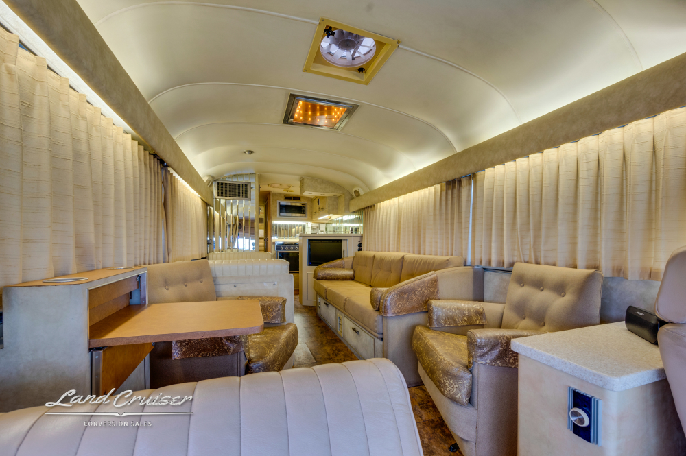 Seating area showcasing the lights inside a MCI 8 Bus Conversion