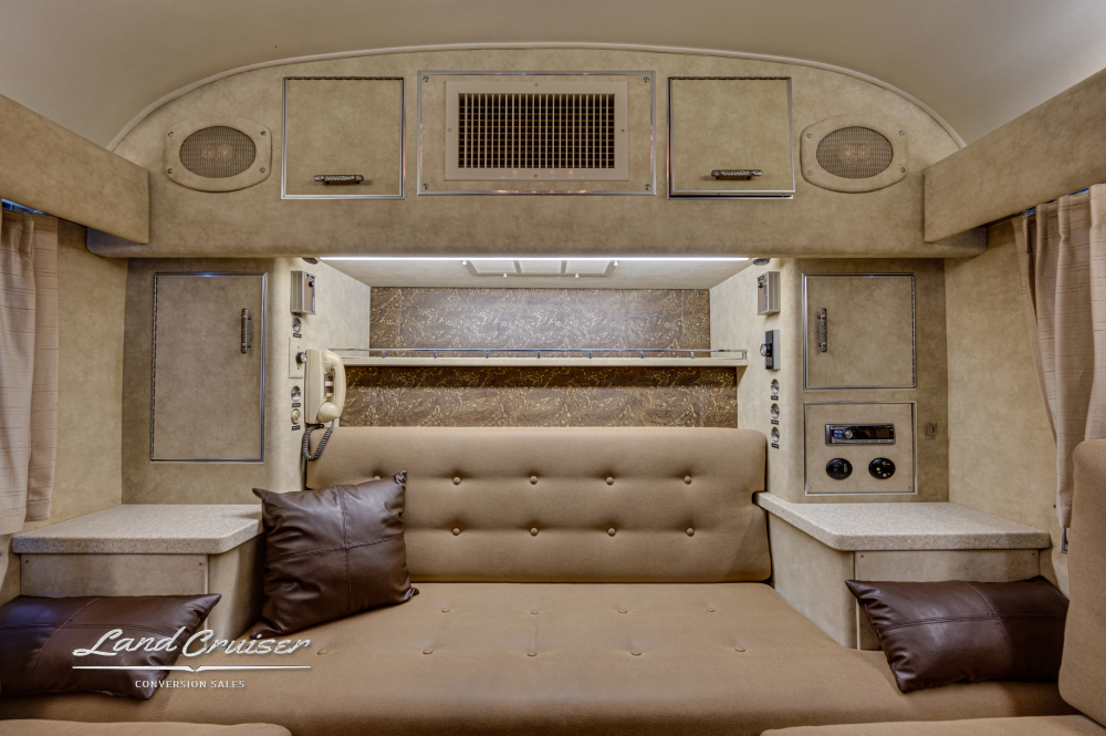 This view is of the bed inside this MCI Bus Conversion that is for sale showing the spacious bedroom.