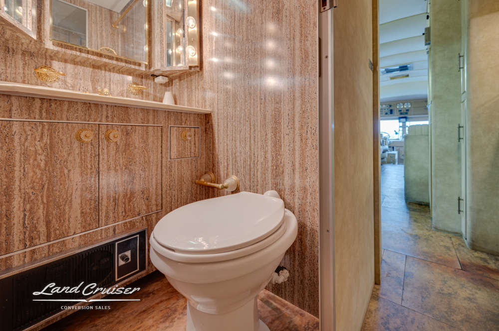 A view of the toilet inside of a Custom Coach