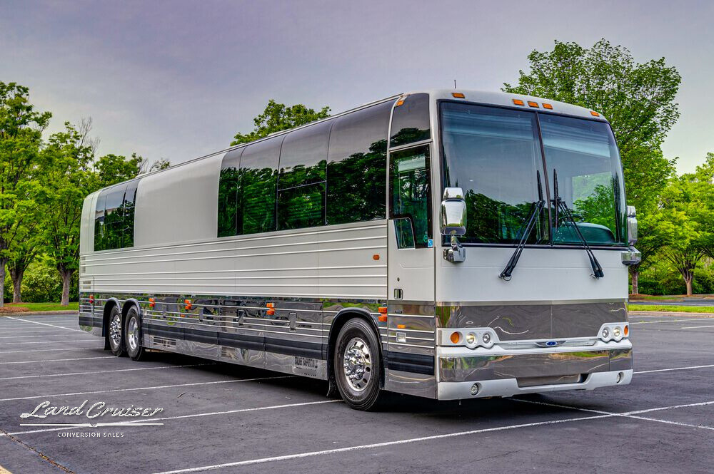 Front-side angle of Shogun Prevost XLII coach showcasing polished siding and full slide-out