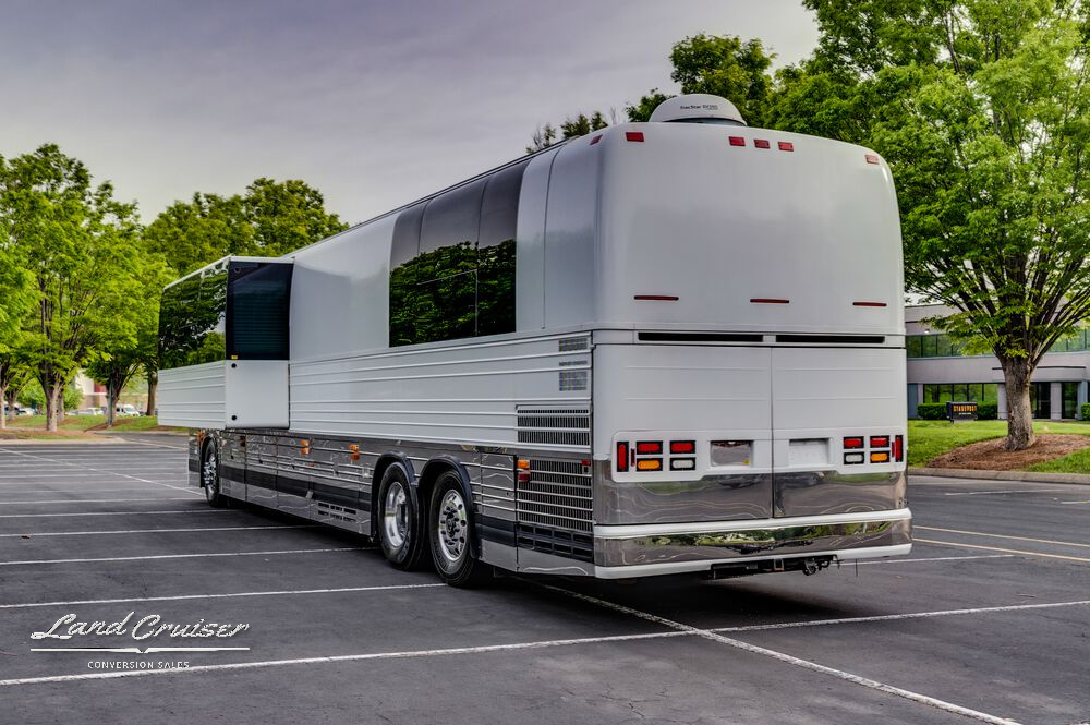 Rear-side view of Prevost Shogun coach showing full slide-out and taillight assembly