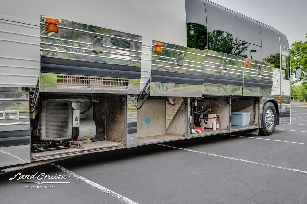 Shogun coach underbody access showing generator bay and polished aluminum cladding