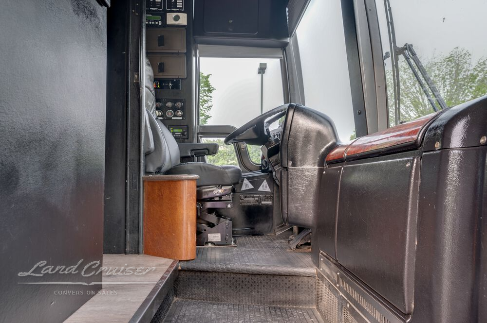 Driver entry area in Prevost XLII entertainer bus with custom step trim and cockpit access