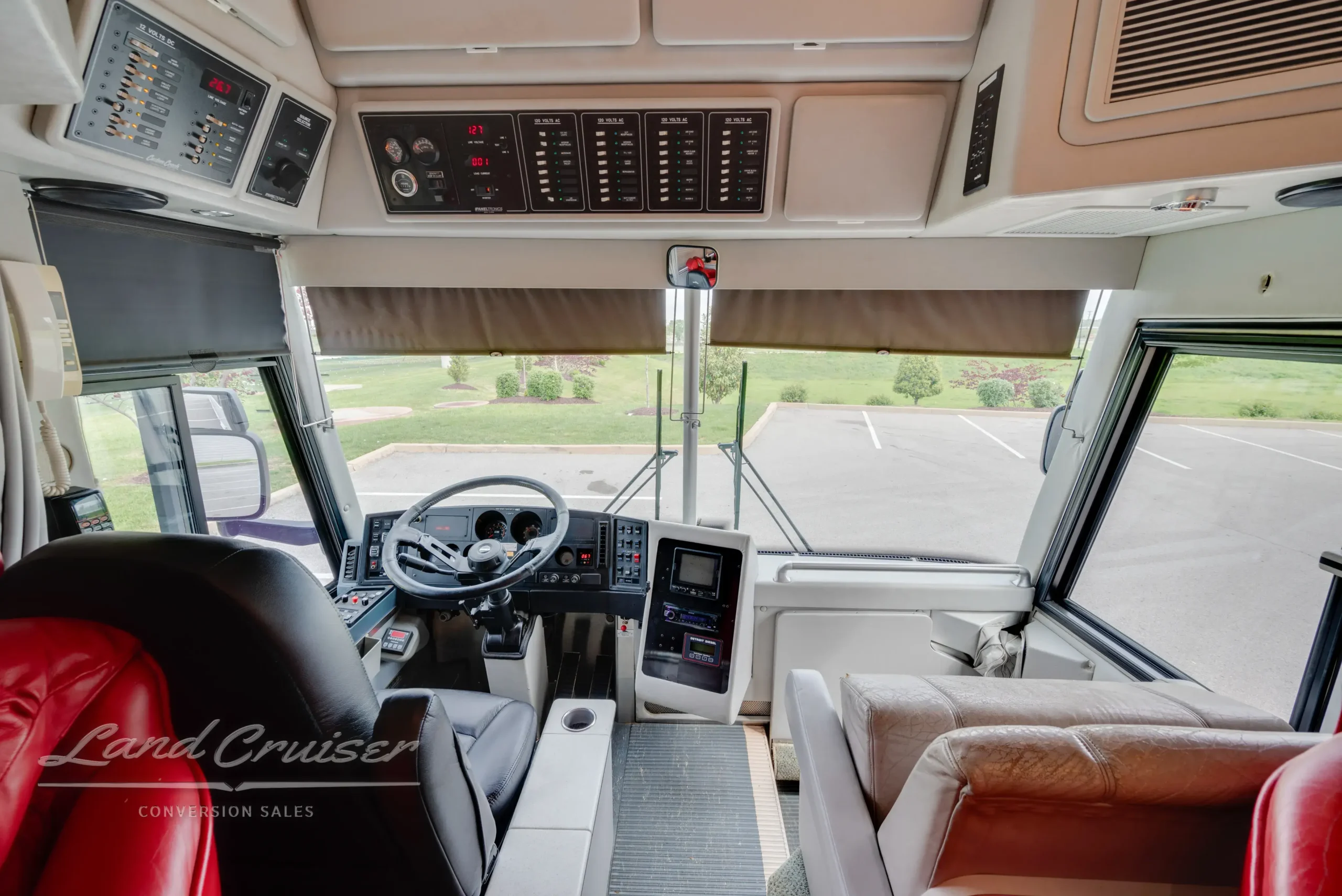 Front cockpit of MCI coach showcasing dashboard electronics, command center, and steering column