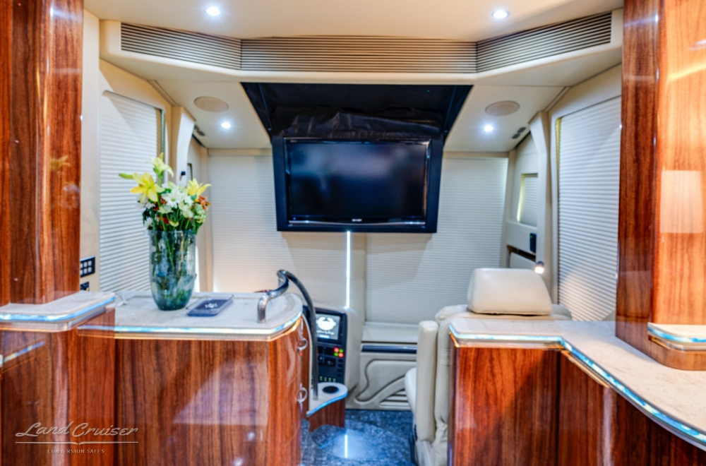 Image showing a tv inside a Marathon 1174 bus conversion with quad-slides.