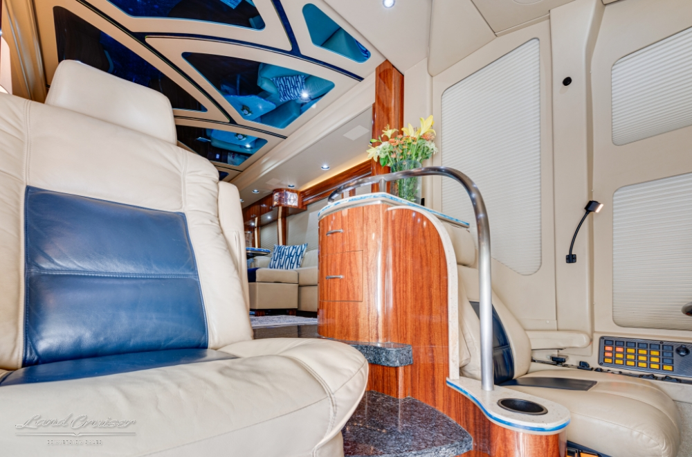 Close up view of driver area inside a Hd-45 quad slide bus conversion.