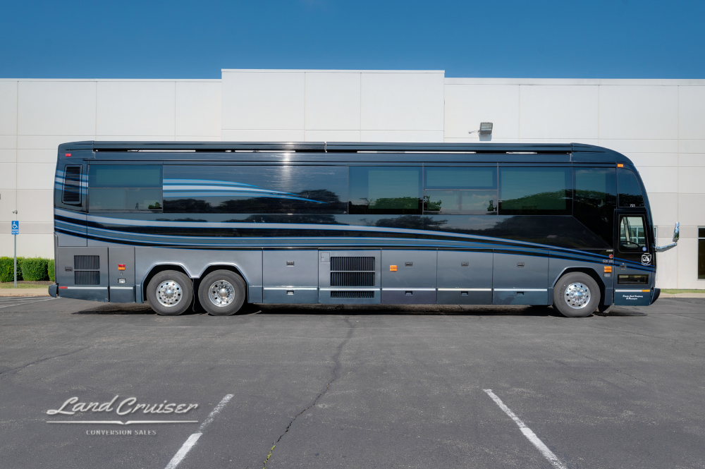 Full side profile of the Amadas VIP coach, highlighting its 45-foot length and streamlined exterior.