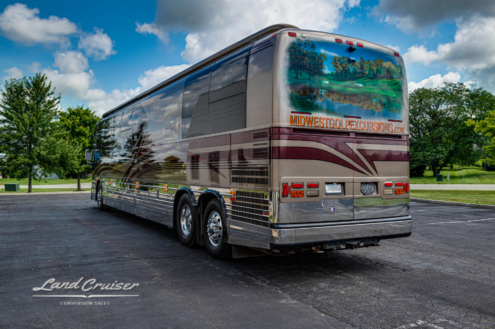 Three-quarter rear view of Prevost XLII Pinehurst with polished aluminum rims and roofline AC units