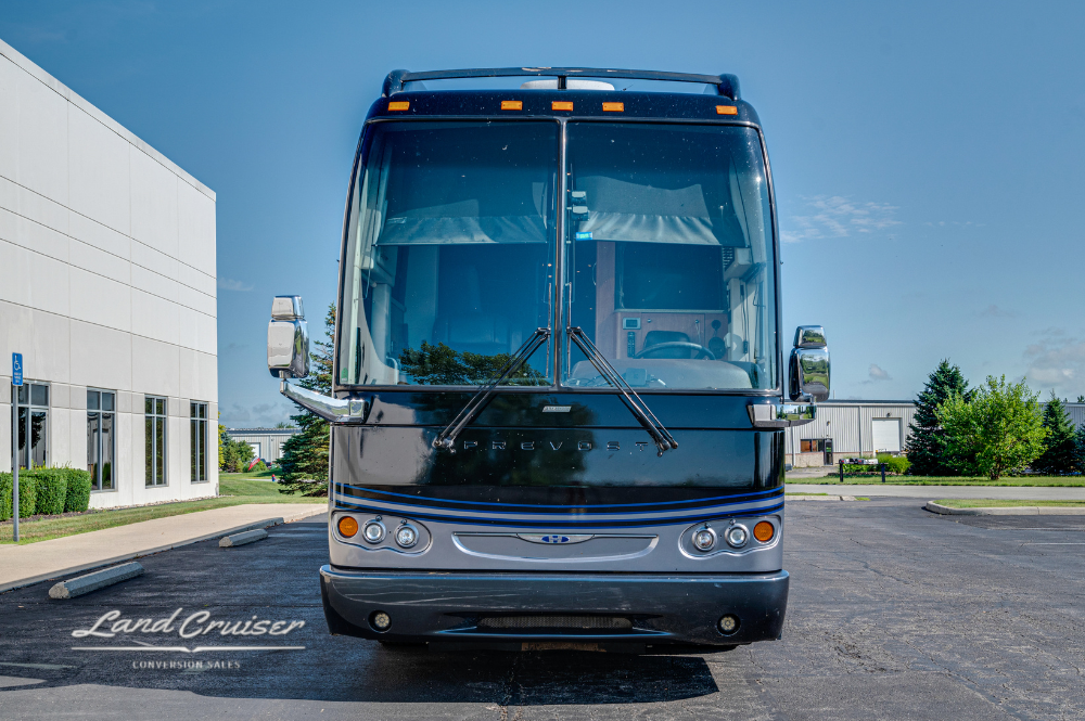 Front head-on view of the Prevost Aretha coach, displaying its clean windshield and symmetrical design.