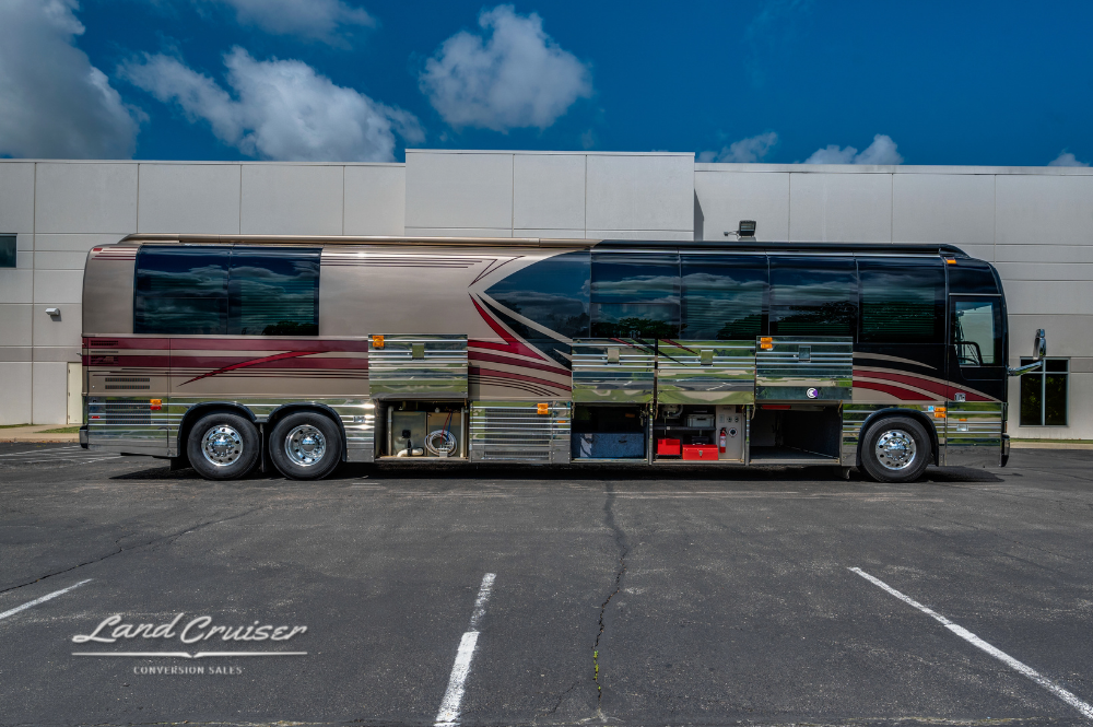Driver-side view with all lower bays open on 45ft Prevost XLII executive motorhome