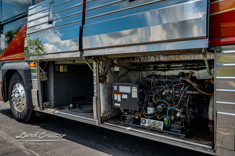 Detailed view of generator and electrical bay beneath executive coach exterior
