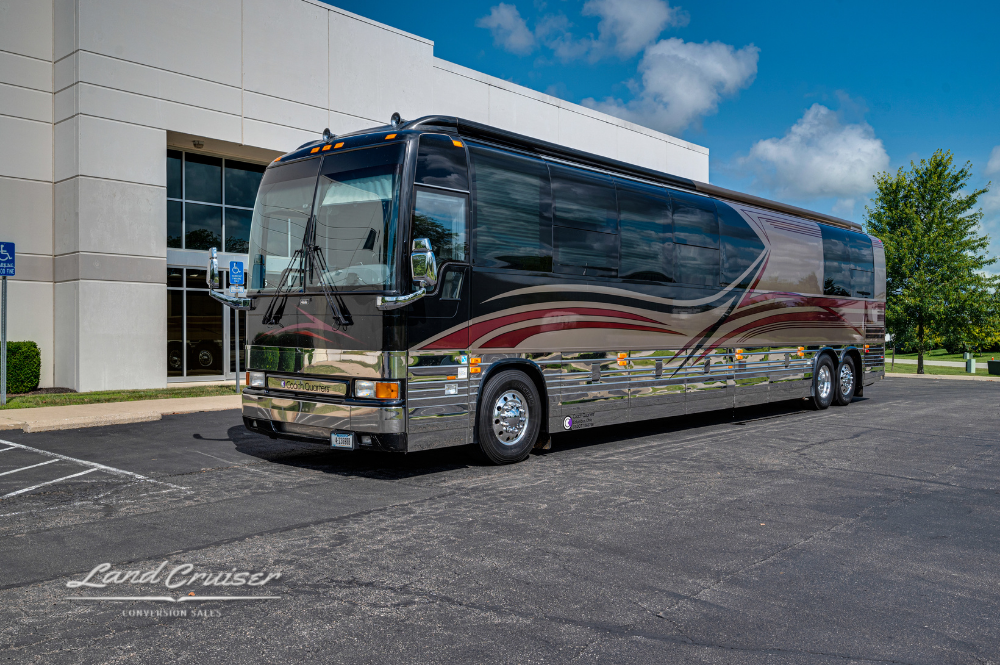 Front-angle exterior shot of 2002 Prevost XLII motorhome with custom paint by Custom Coach Corporation