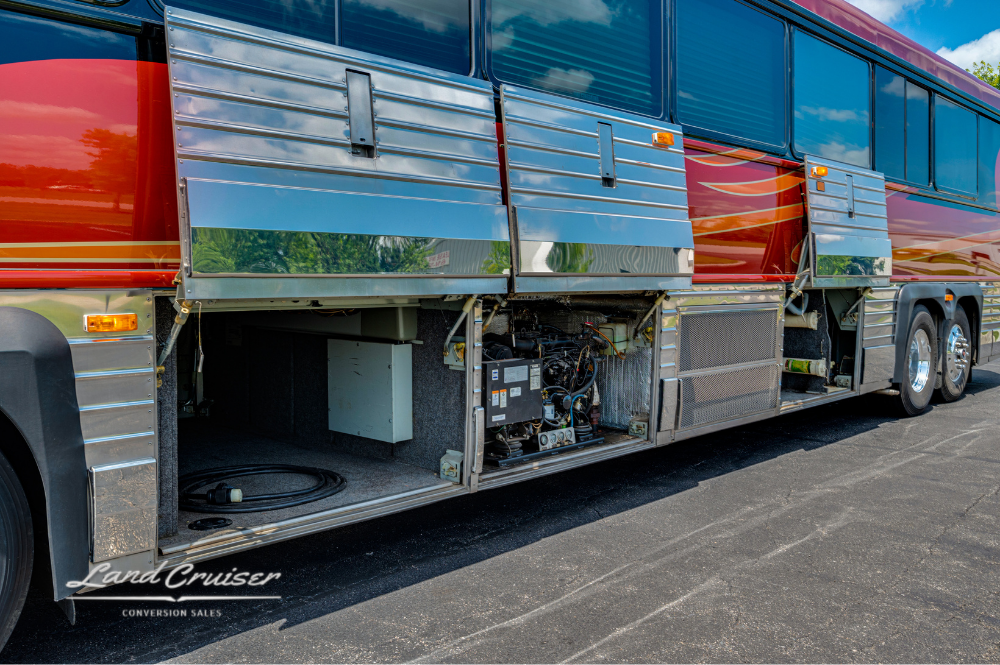 Angle view of mid and rear compartments on passenger side of MCI 102DL3 executive coach