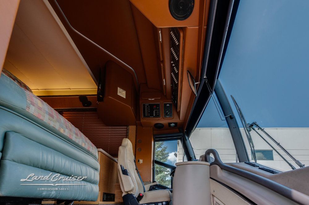 Retracted awning on passenger side of MCI motorhome