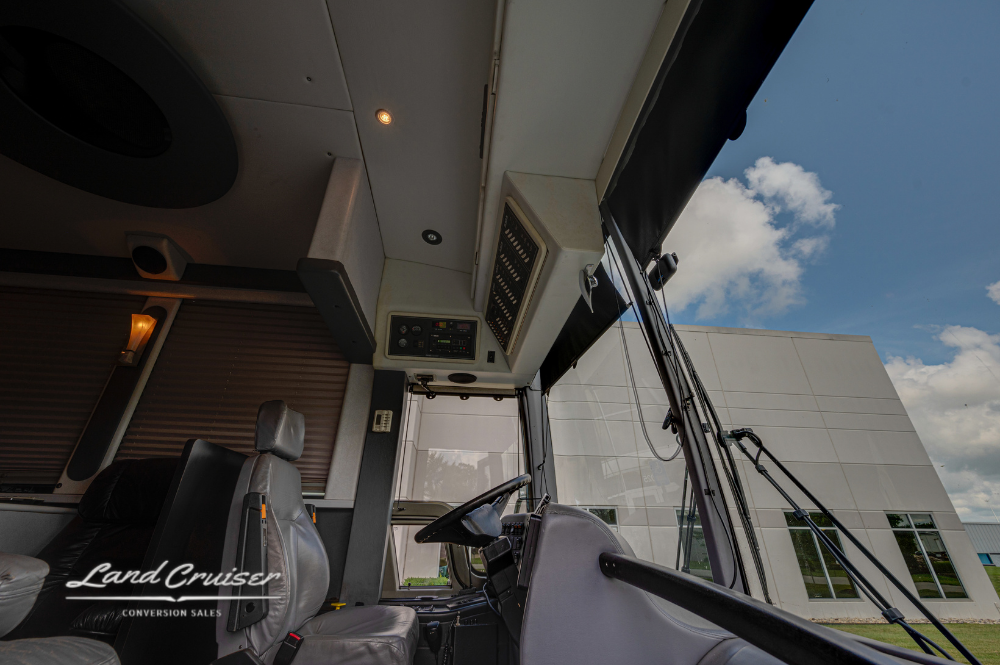 View from inside driver’s area showing motorhome entry and partial galley ceiling features