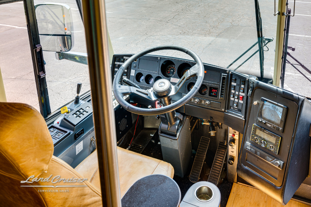 Close-up of Churchill cockpit showing steering wheel, switches, and full dashboard control setup
