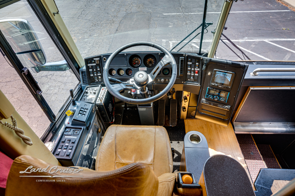 Overhead angle of driver's seat and dashboard layout with gear shifter and climate controls