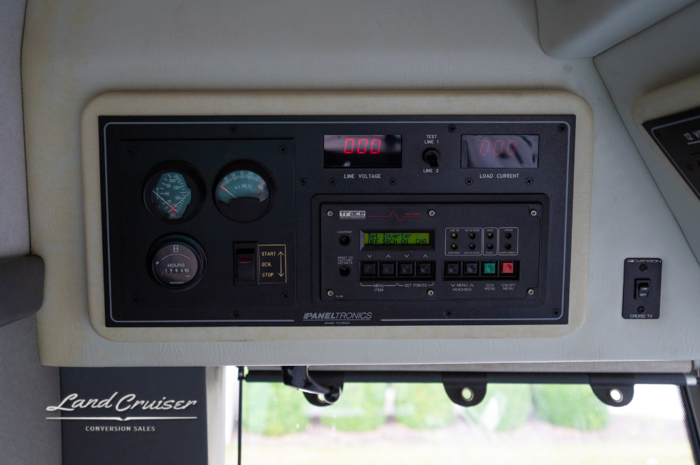 Driver-side control cluster including ignition, gauges, and system controls on 2002 Prevost XLII